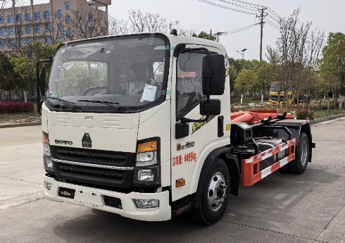 下地下室的重汽豪沃蓝牌勾臂垃圾车_楚胜牌CSC5049ZXXZ6型车厢可卸式垃圾车
